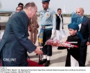 Hazar Imam accepts a bouquet of flowers from a child at PAF Airbase Chaklal, Pakistan  2003-05-02